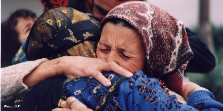 Elderly woman embracing
