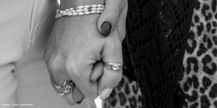 Two holding hands
