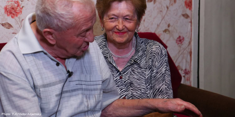 Smiling elderly couple