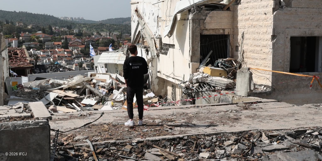 Emergency responders assess damage after building collapse.