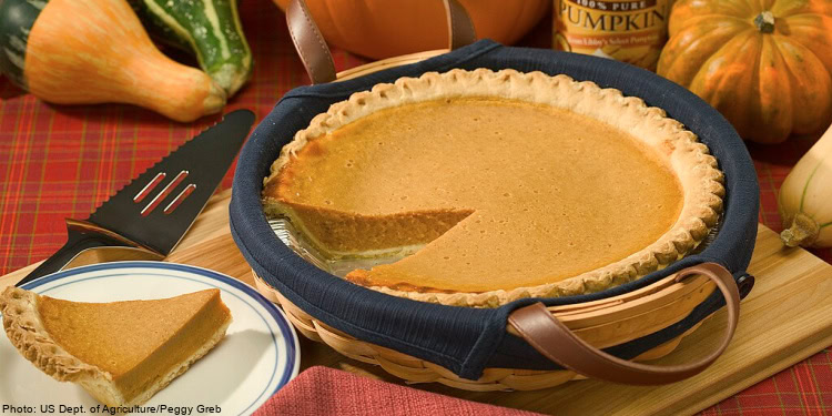Pumpkin pie sitting on the dinner table