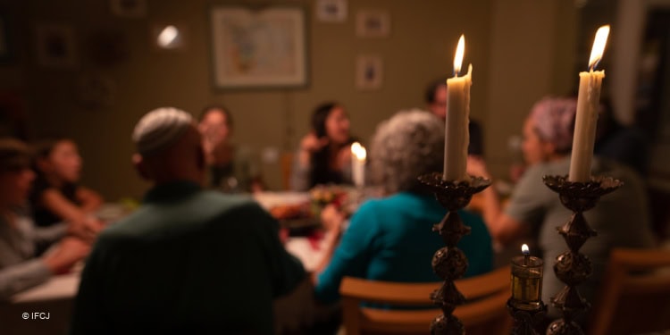 Family sitting around the table having dinner