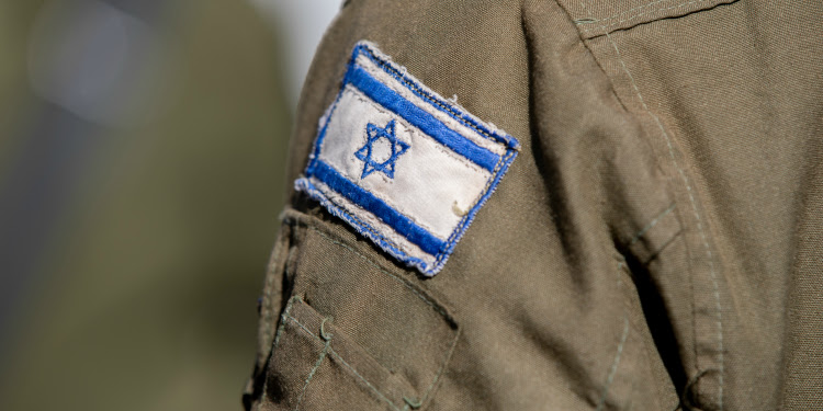 Close-up of Israeli flag patch on IDF soldier's jacket
