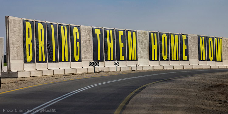 A sign calling for the release of Israelis held hostage in the Gaza Strip near the Israeli border with the Gaza Strip