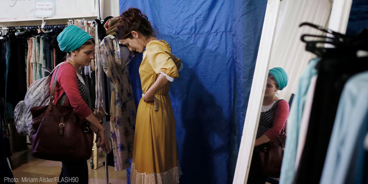 Orthodox Jewish women enjoy shopping at a clothing store