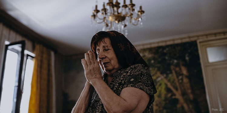 Elderly woman praying