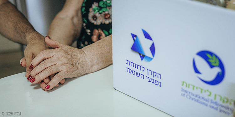 Elderly woman holding hands with young man