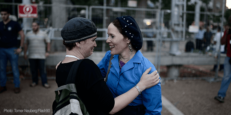 Two women embracing