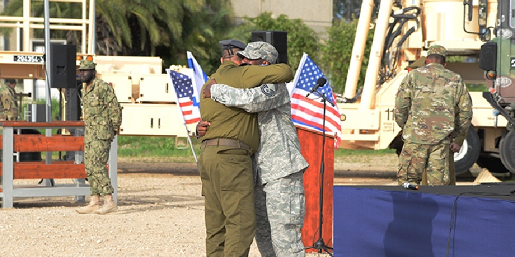 Soldiers from nation of Israel and U.S. embrace