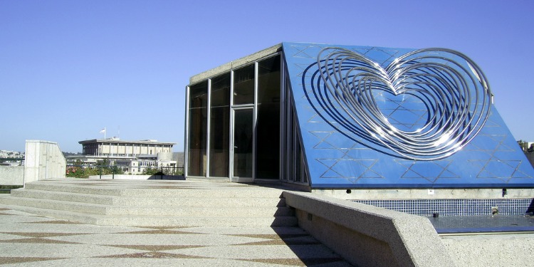 A building with a sculpture of a heart on it.