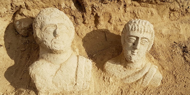 Two statues discovered in the sand.