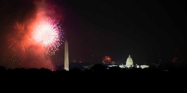 Fireworks in the sky with Capitol Hill and Washington Monument in the background.