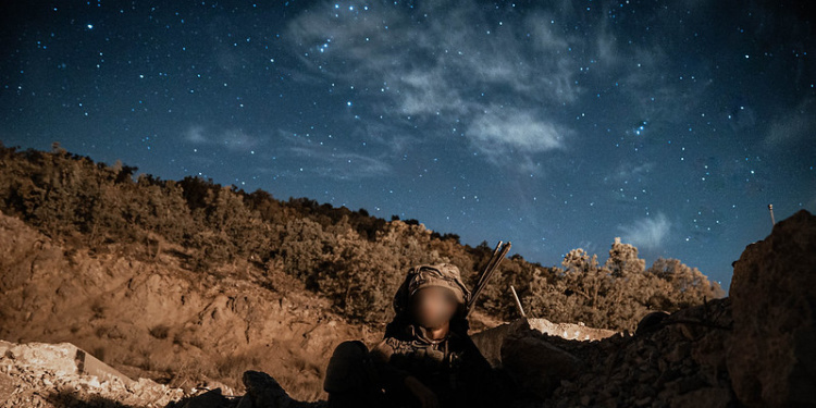 IDF commando under lights of Israeli night sky