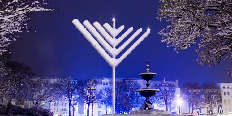 Hanukkah menorah in winter snow