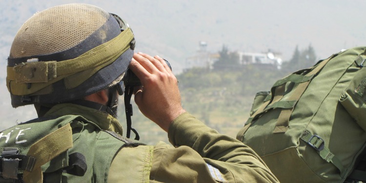 IDF soldier looks into Syria from Golan Heights
