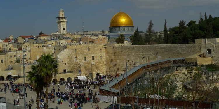 Aerial view of people walking in front of the Temple Mount during the daytime.