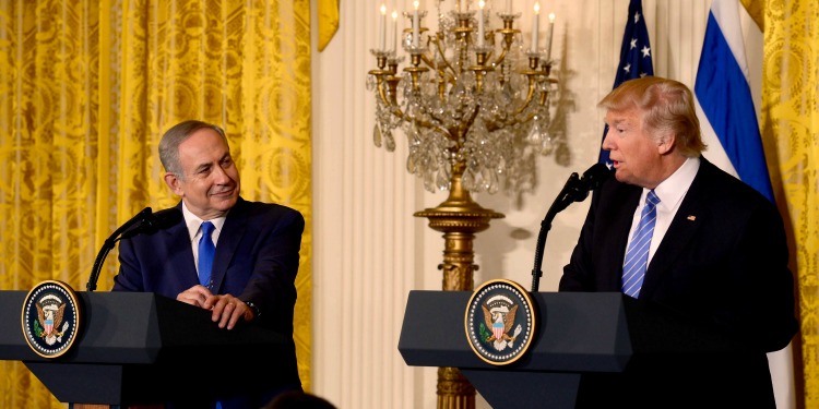 President Bibi and President Trump both talking at podiums with the American and Israeli flag behind them.
