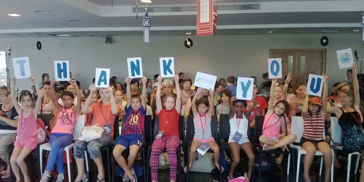 Several kids holding up a Thank You sign for IFCJ.