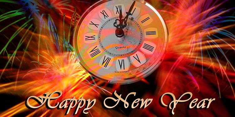 Animated photo of a clock that reads Happy New Year in front of it.