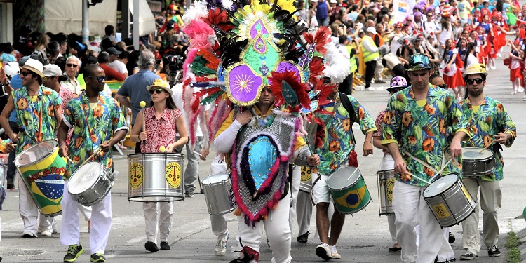Drummers walking in a Purim parade.