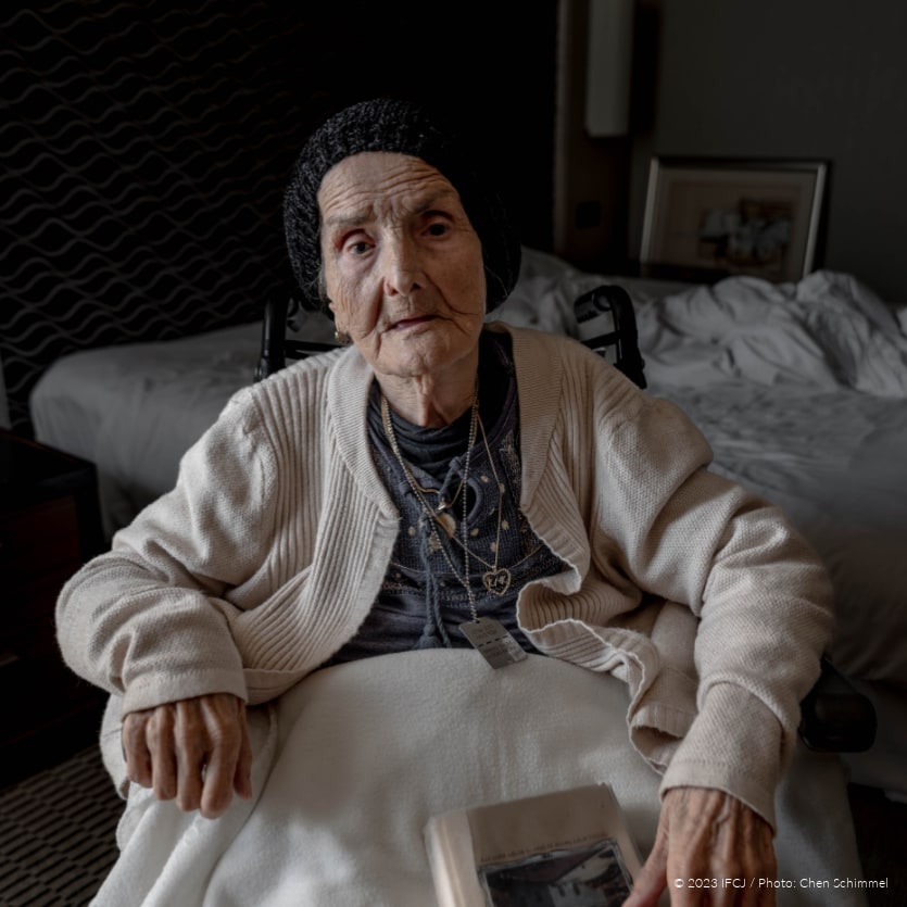Tamar Yifrach, survivor of Terror Attack on October 7, 2023 Kibbutz Kfar Aza, elderly woman in wheelchair with necklace that says 