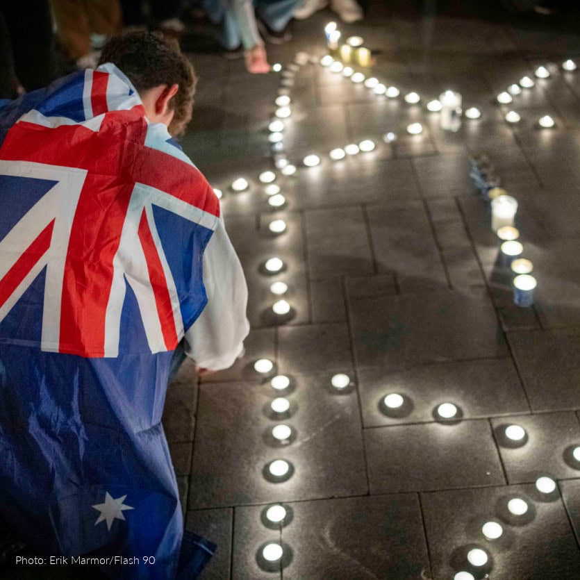 People light candles in memory of the victims of the mass shooting attack in Sydney targeting the Jewish community during Hanukkah celebrations, in Tel Aviv