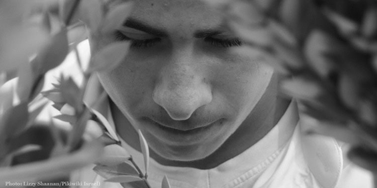 Israeli boy with four species on Sukkot