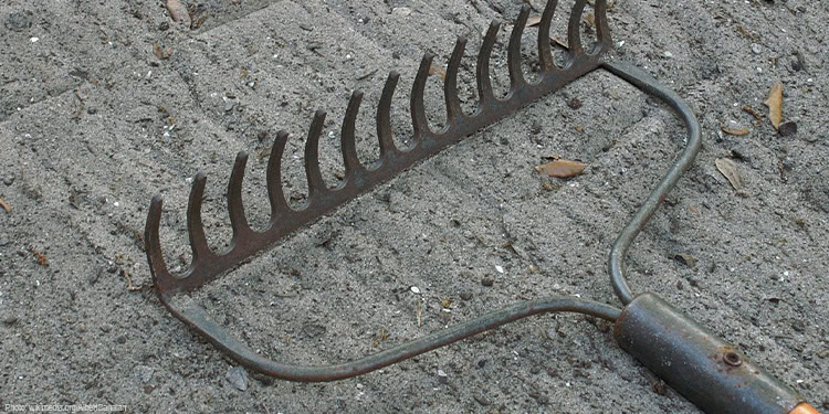 A rake laying on the ground