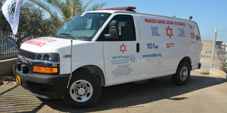 A white IFCJ ambulance van