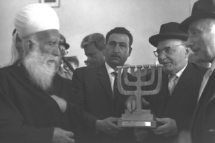 Sheik Amin Tarif presenting Zalman Shazar, the third President of Israel, with a menorah made of olive wood