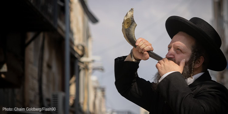 An Ultra Orthodox Jewish man blowing the shofar