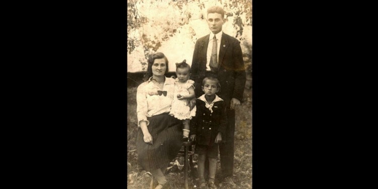 Dated image of a couple and their two daughters.