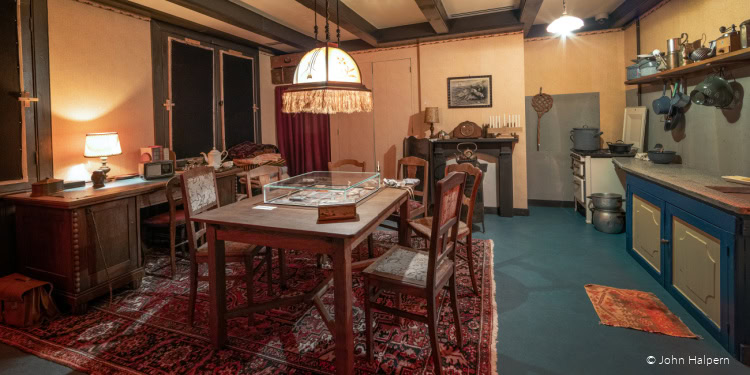 Vintage Jewish home interior with traditional furniture, wooden dining table, and cozy lighting, showcasing a warm and nostalgic atmosphere.