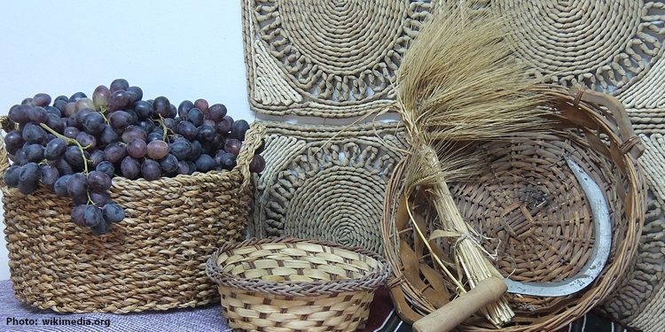 Barley and grapes in woven baskets.