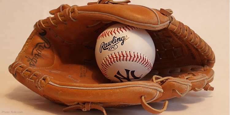 Baseball mitt holding a baseball