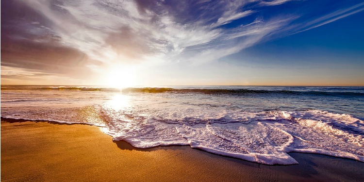 The beach as the sun is starting to sunset.