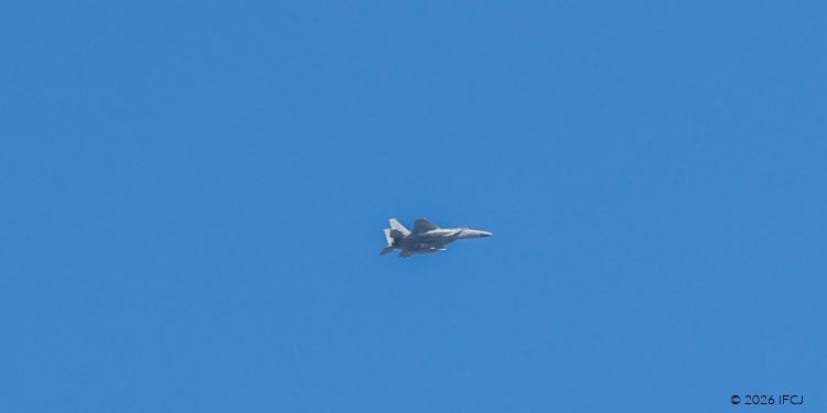 Israeli fighter jet soaring through a clear blue sky, showcasing advanced military aircraft capabilities.