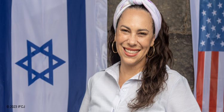 Yael Eckstein at Berko Archaeological Park (ancient ruins in Tiberias, Israel). white dress Israeli and American flags