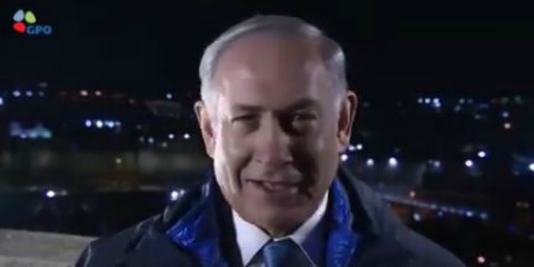 Bibi doing a solo interview while standing outside at night.