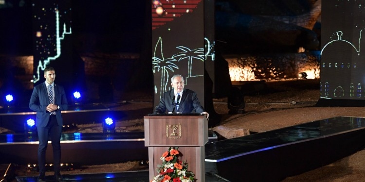 Bibi speaking at a podium on Jerusalem Day in 2019.