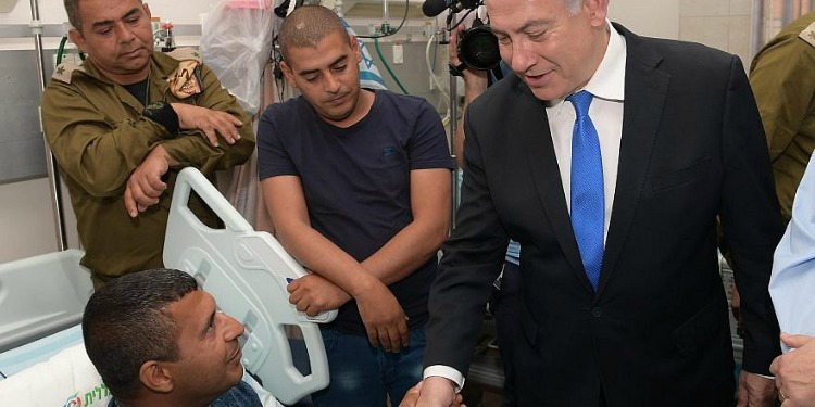Bibi visiting soldiers in the hospital.