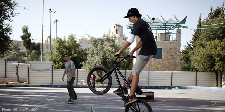 Young Israelis seen bicycling and skateboarding in the Jerusalem Bell Park, where Jerusalem mayor layed the corner stone for the new skateboard park