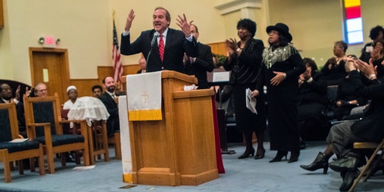 Rabbi Eckstein giving a speech in a church.