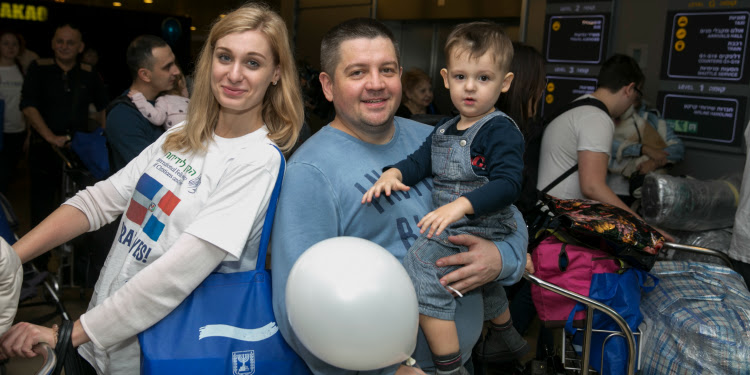 Family of three whom just got off a freedom flight.