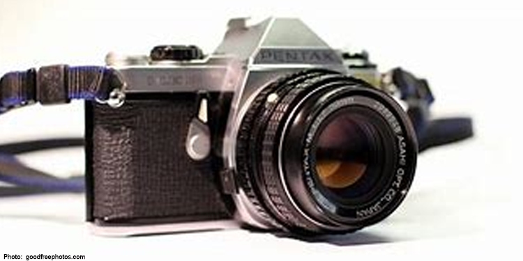 An older digital camera against a white background.