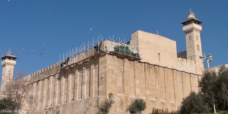 The cave of patriarchs building from the outside against a blue sky.