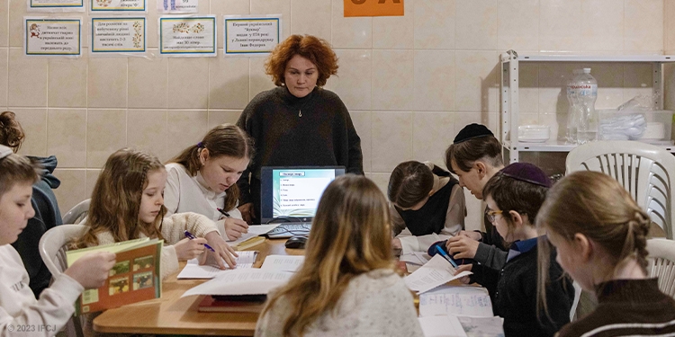 Children in a classroom with a teacher