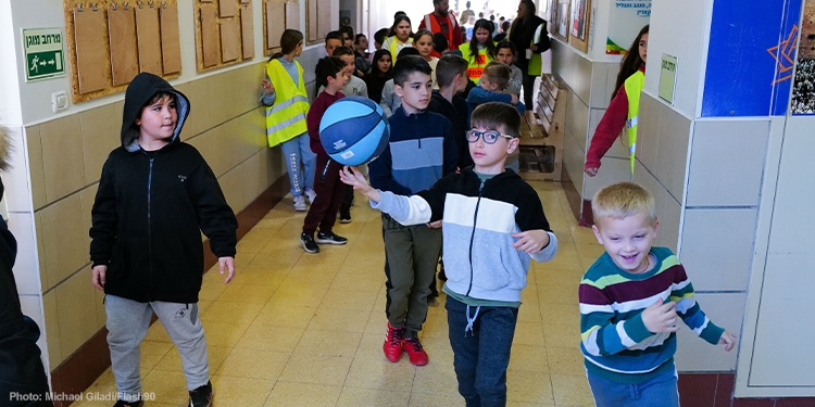 Children walking through the school hall