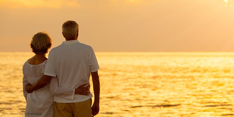 Couple standing watching a sunrise