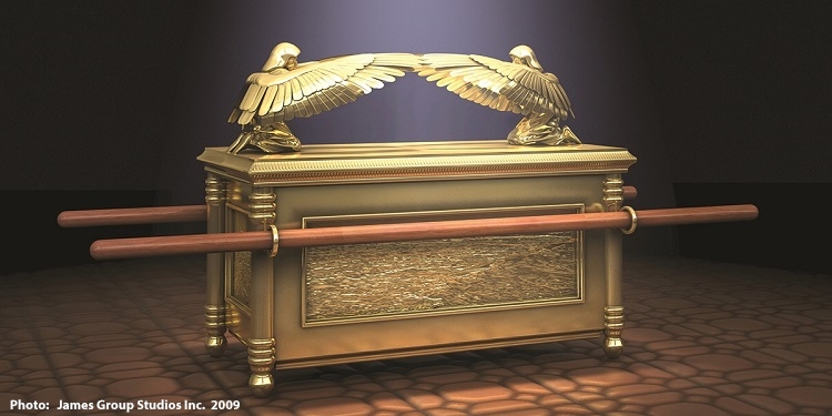 A golden ark with two eagles on it.
